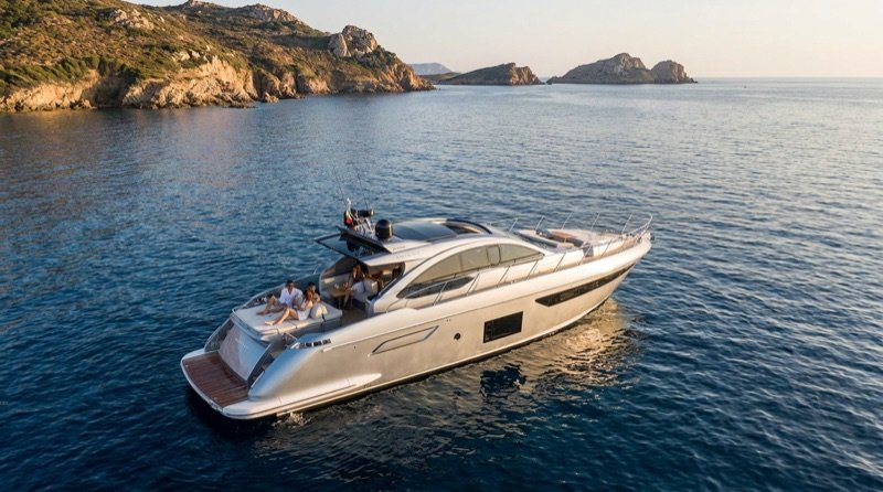 Motor yacht cruising through calm coastal water